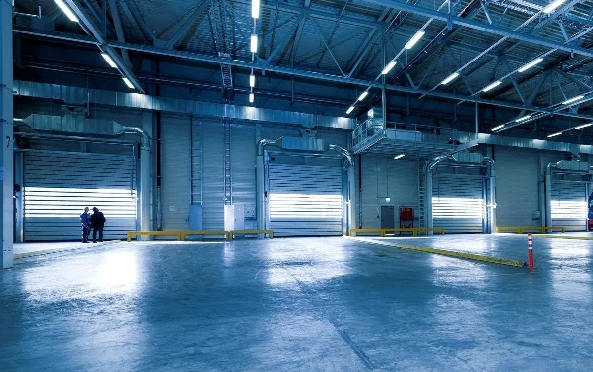 Empty warehouse with roller-door loading docks